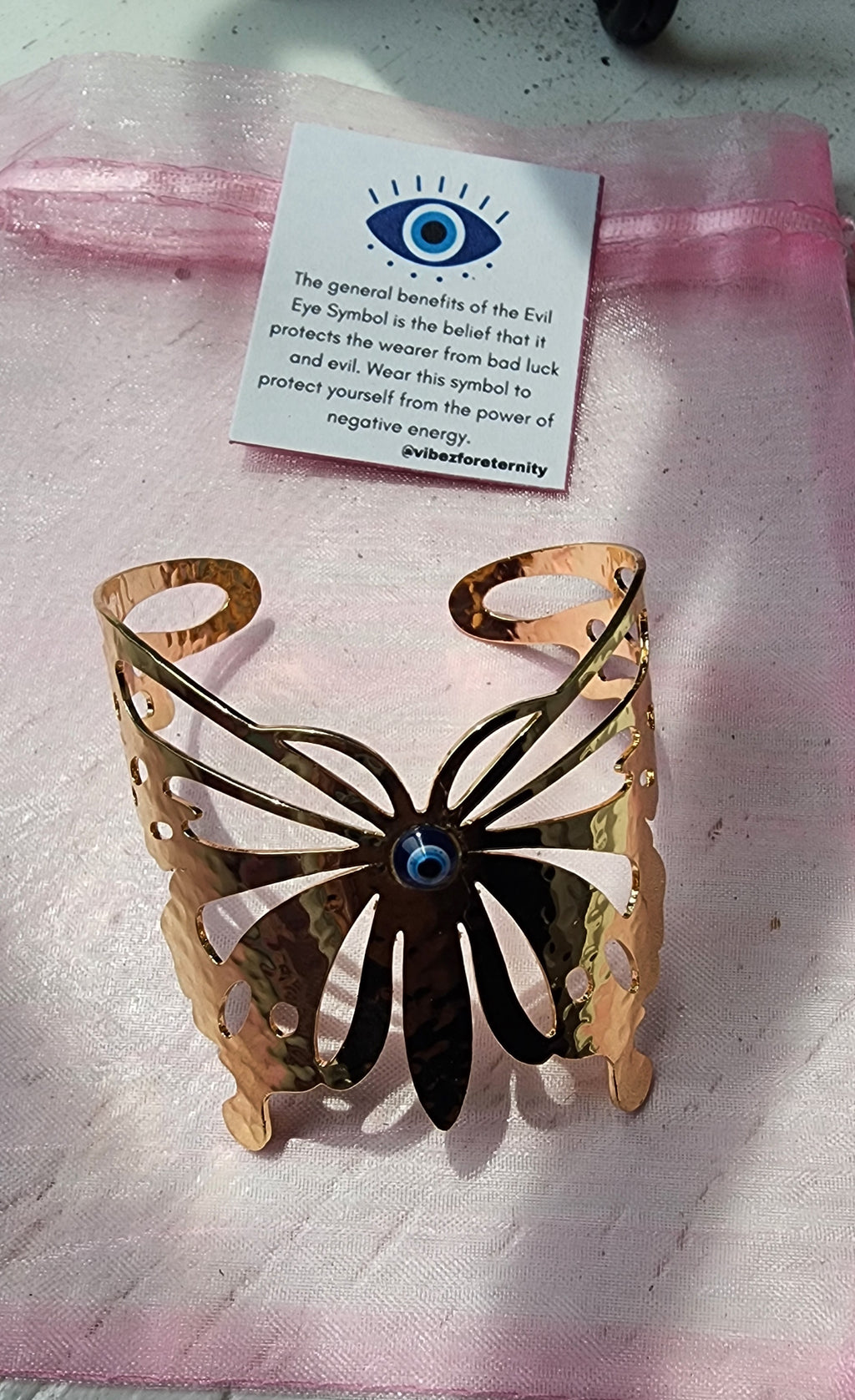 -Gold evil eye butterfly