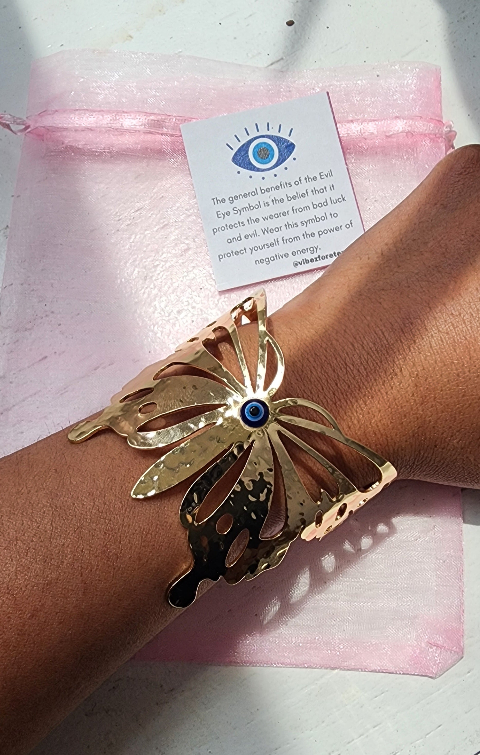 -Gold evil eye butterfly