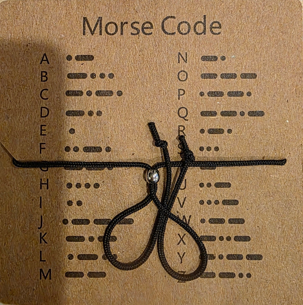 Pulsera «Nunca te rindas» en código Morse