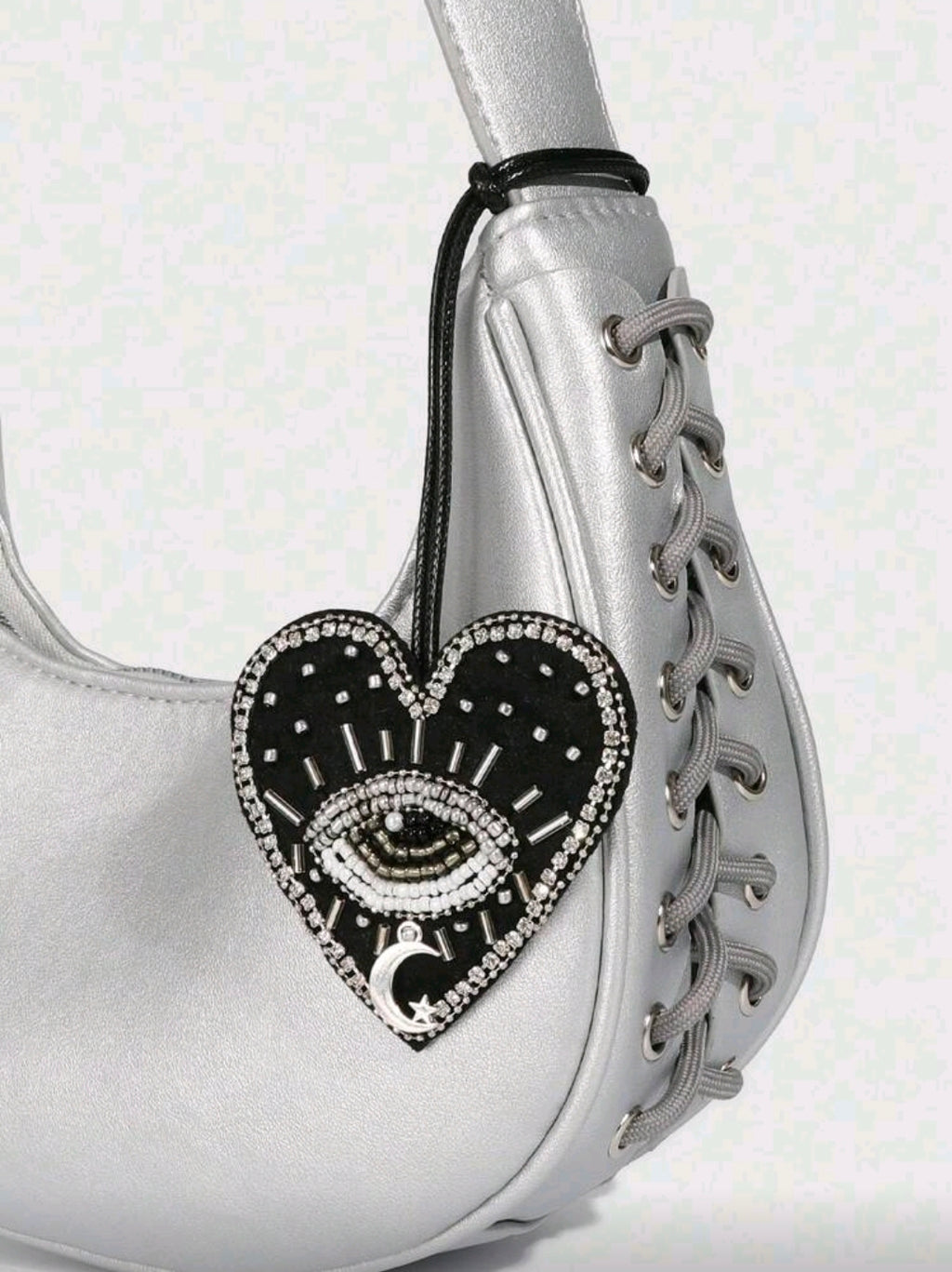Black heart evil eye accessory