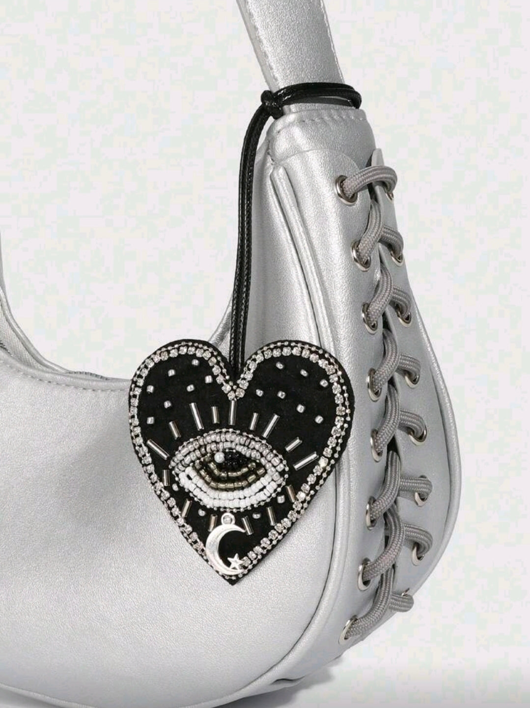 Black heart evil eye accessory
