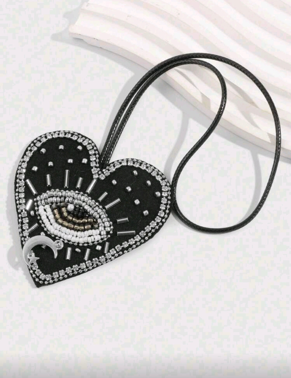 Black heart evil eye accessory