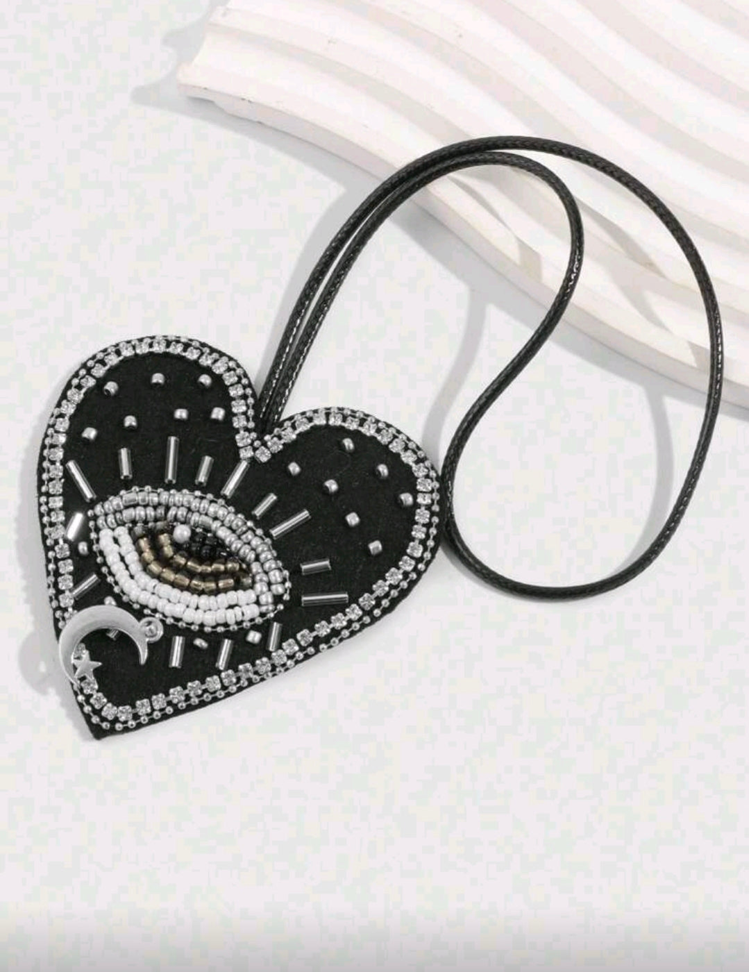 Black heart evil eye accessory