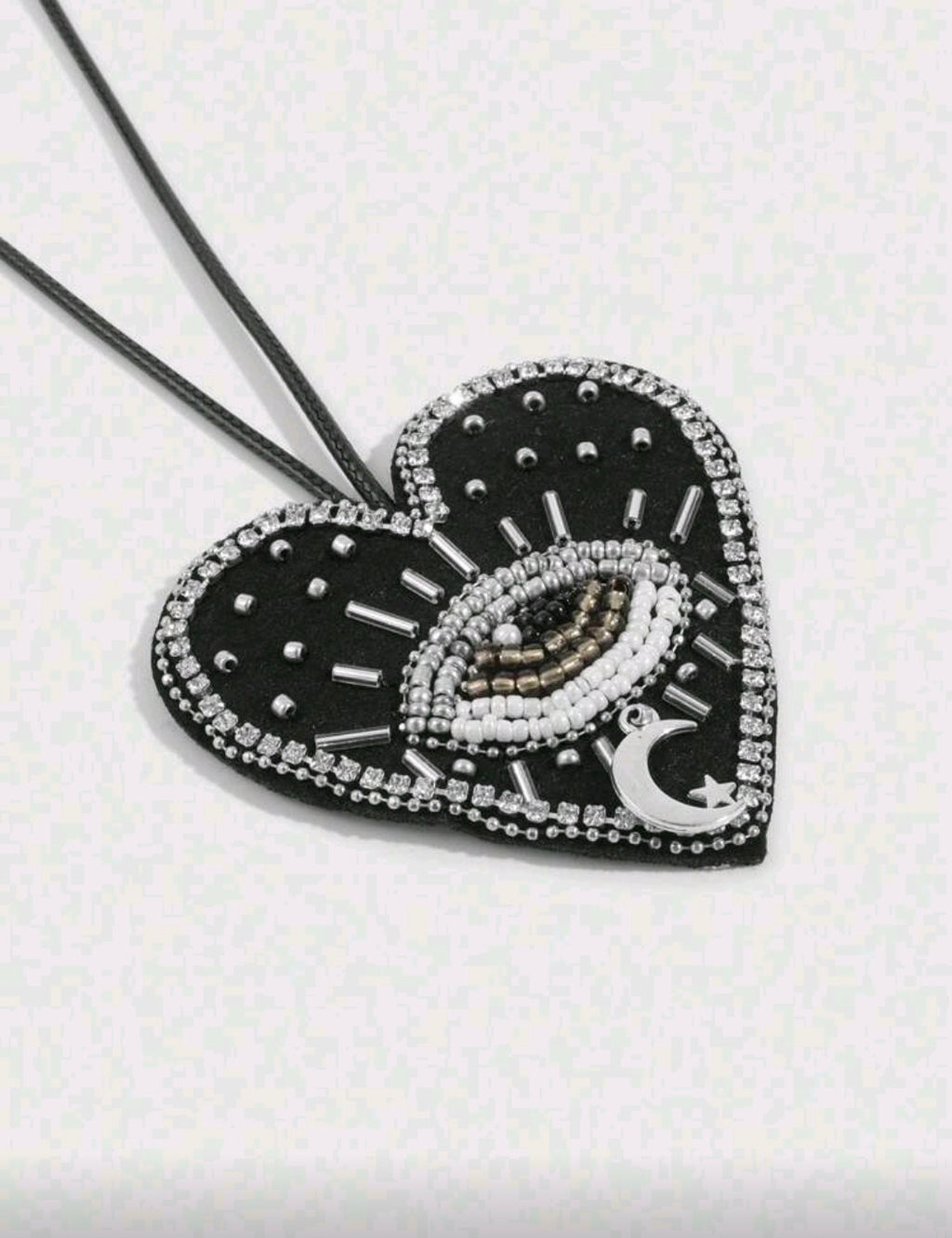 Black heart evil eye accessory