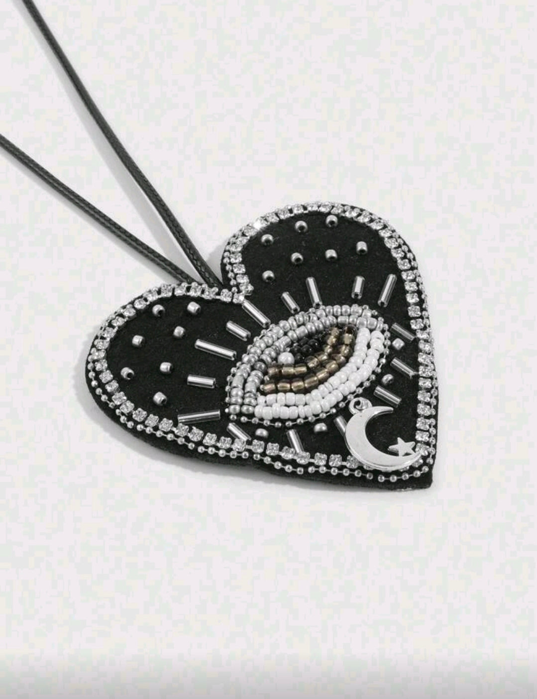 Black heart evil eye accessory