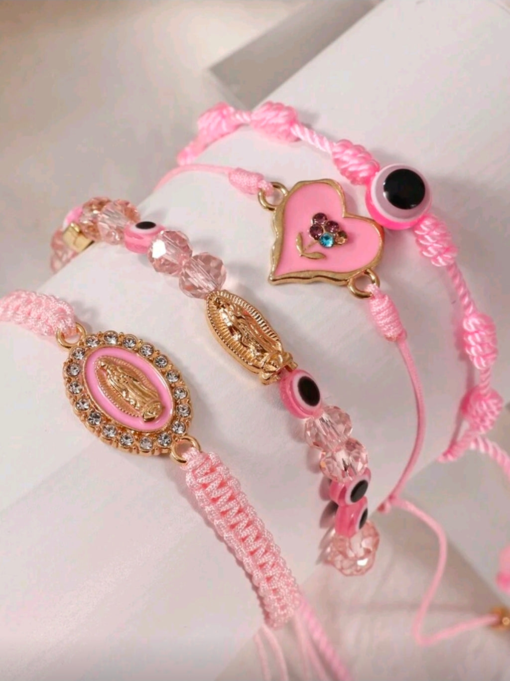 Four pink bracelet set