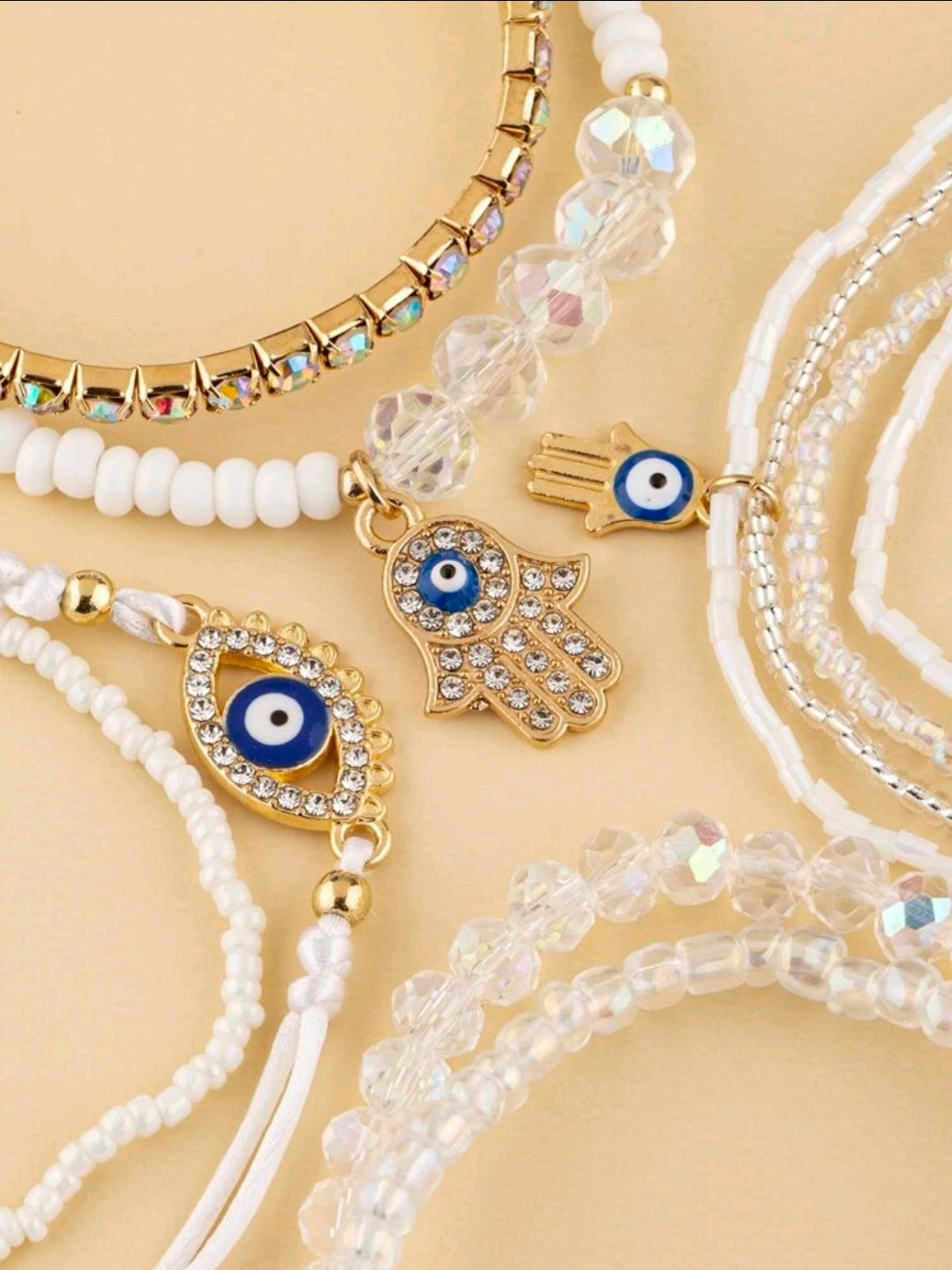 -9 pulseras blancas con el ojo turco